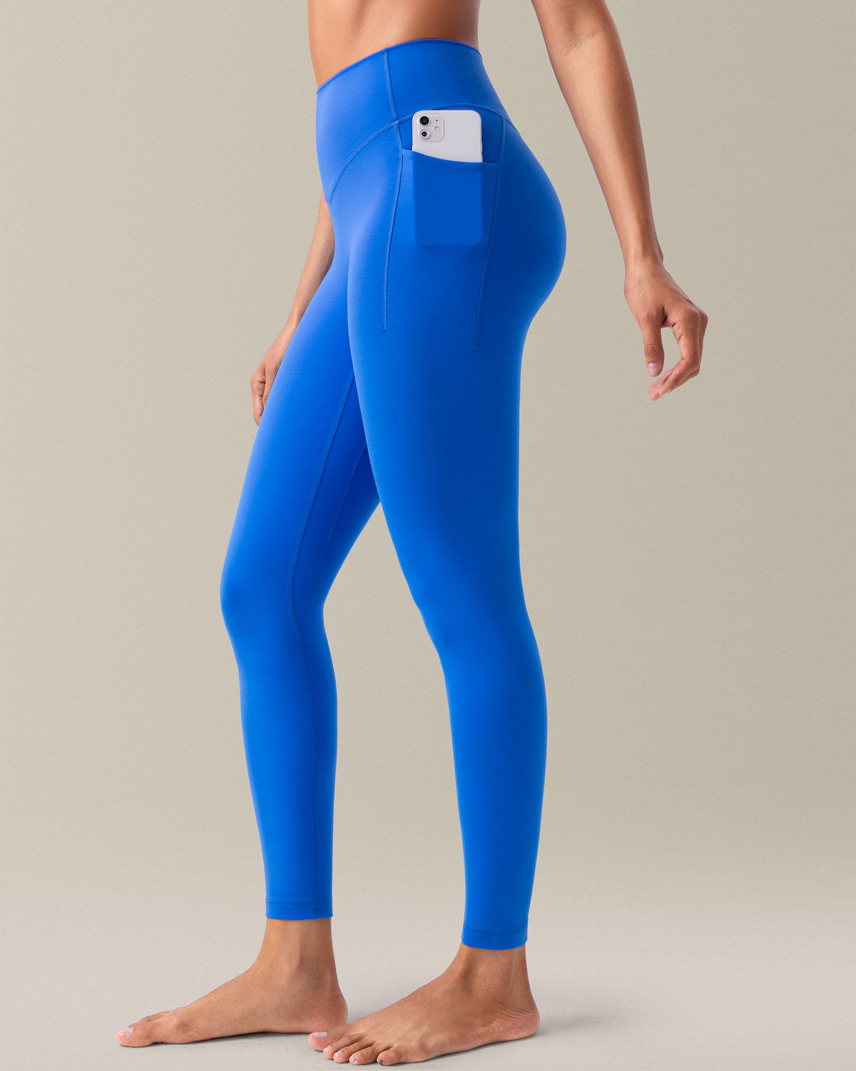 YUNOGA HugMotion women's high-waisted leggings in Princess Blue, featuring no front seam design and side pockets.