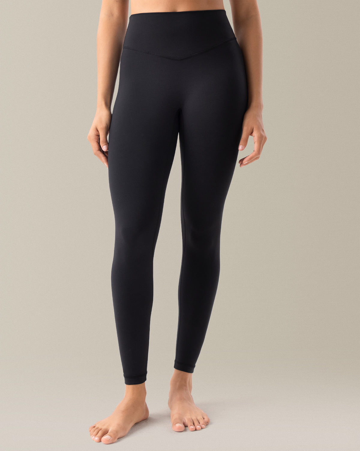 YUNOGA HugMotion Women's 25" No Front Seam Leggings in black, emphasize seamless construction and high-rise waistband.