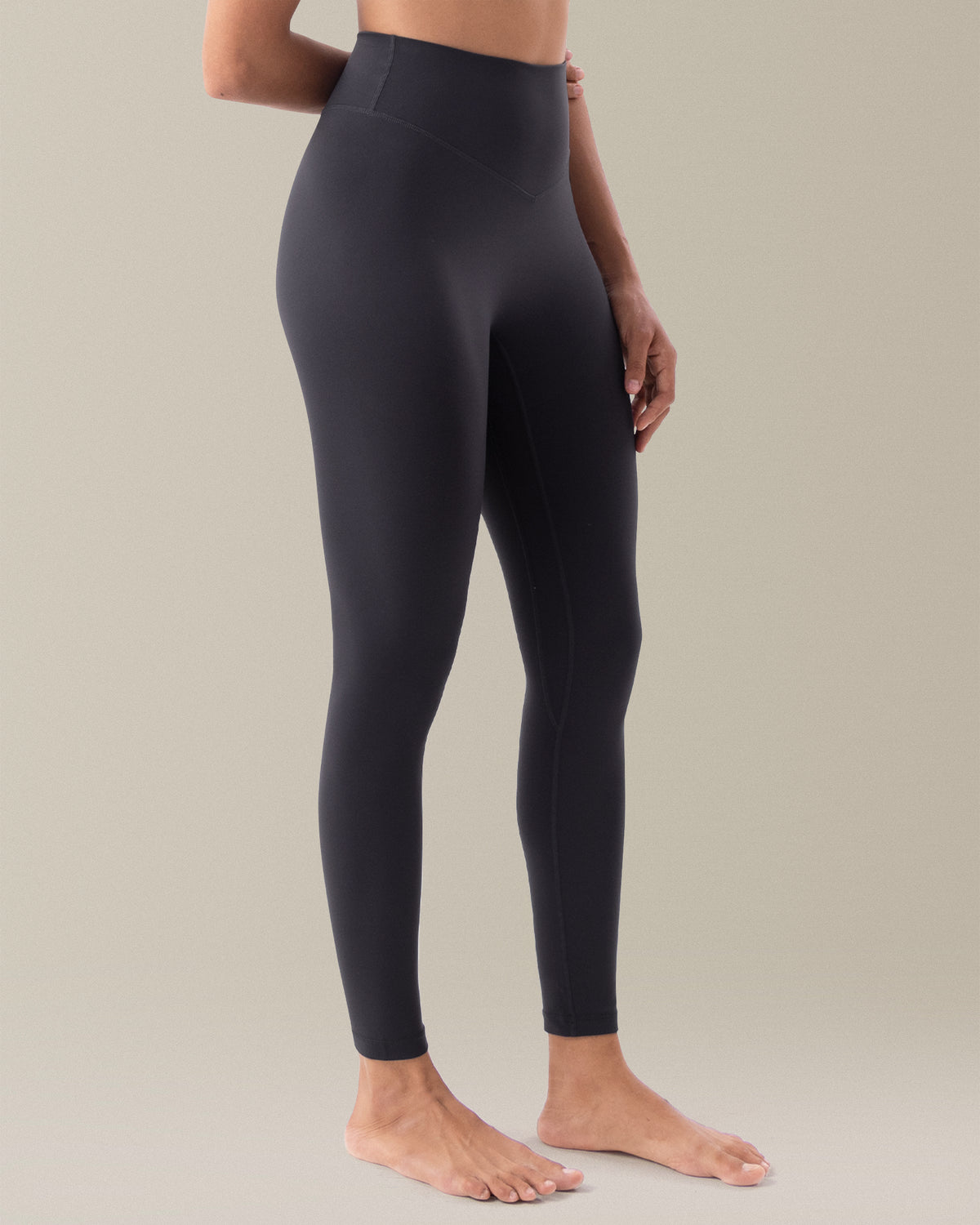 YUNOGA HugMotion Women's 25" No Front Seam Leggings in grey, showcasing sculpting seams and ankle-length design