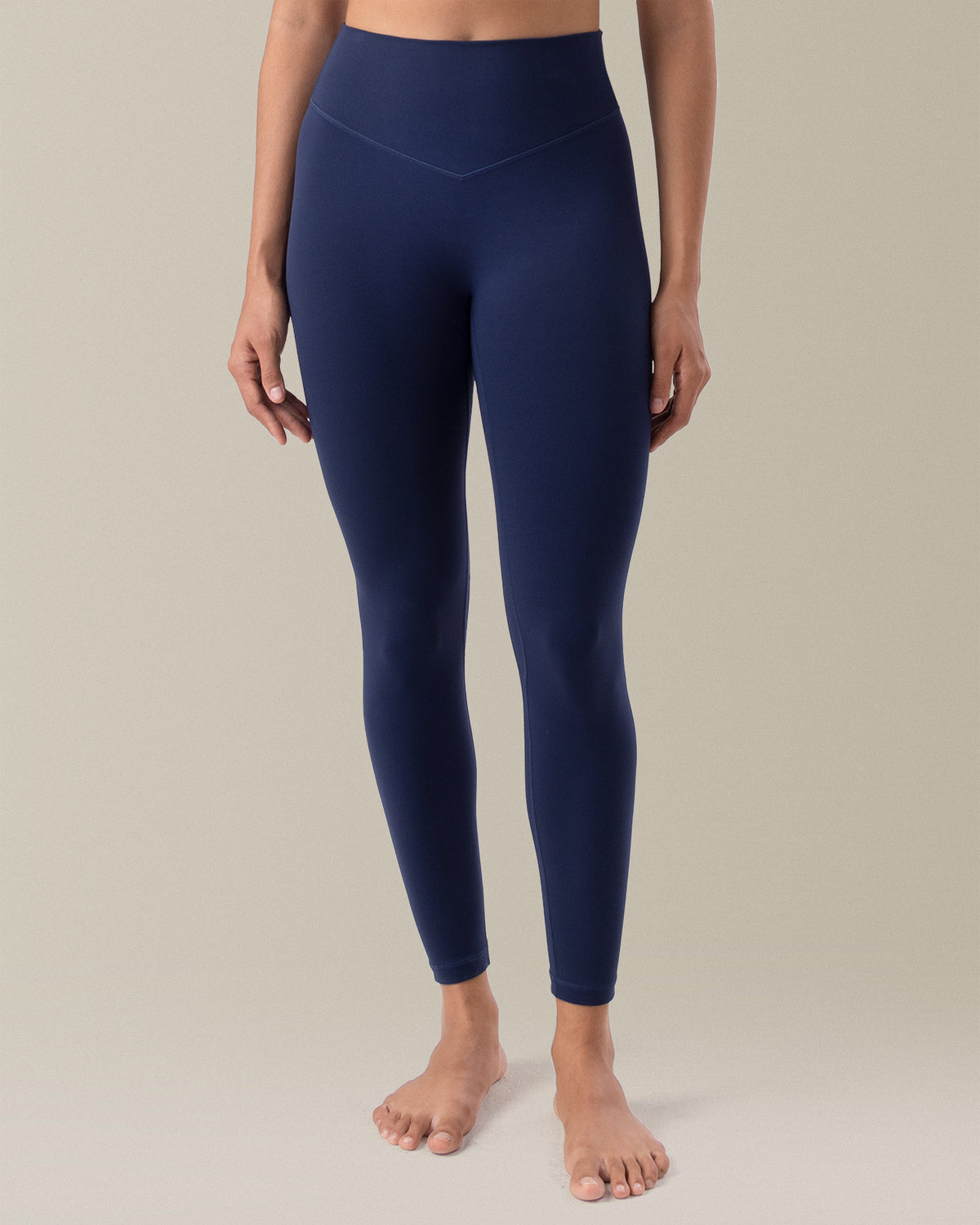 YUNOGA HugMotion Women's 25" No Front Seam Leggings showcases high-waisted design and seamless waistband - Navy Blazer