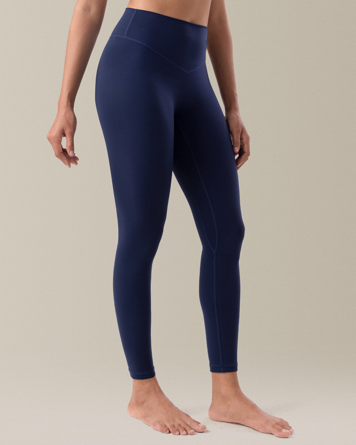 YUNOGA HugMotion Women's 25" No Front Seam Leggings showcases high-waisted design and seamless waistband - Navy Blazer