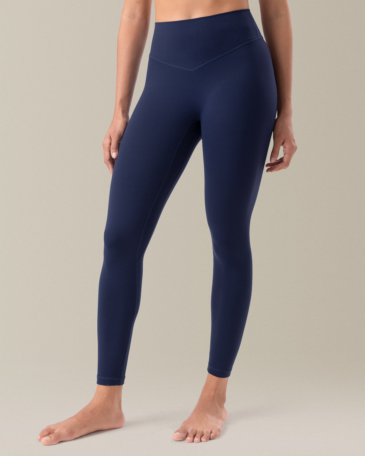 YUNOGA HugMotion Women's 25" No Front Seam Leggings showcases high-waisted design and seamless waistband - Navy Blazer