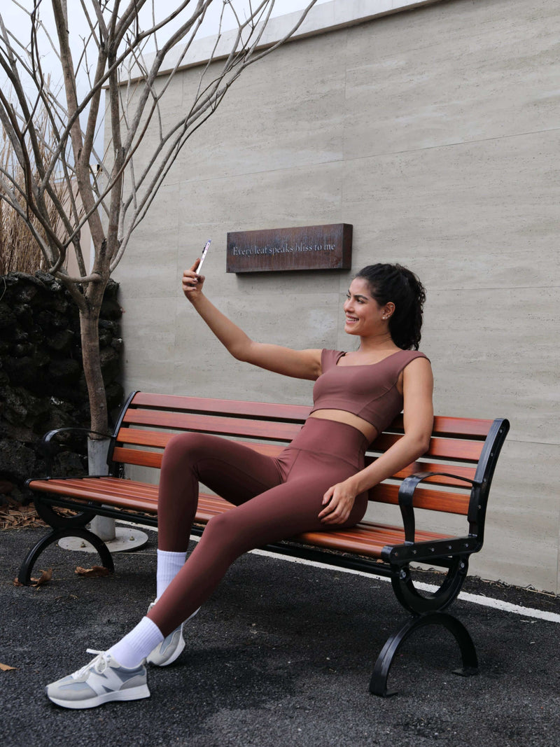 Brown stone matching yoga leggings and tank tops set from Yunoga—relaxed yoga outfit for outdoor sessions or casual wear