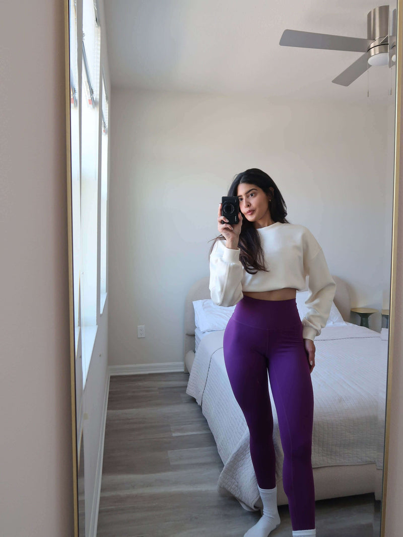 Plum yoga leggings and ivory sweatshirt by Yunoga—comfy home workout outfit for casual daily